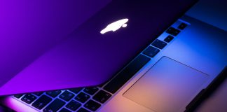 slightly opened silver MacBook