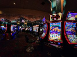 a casino room filled with lots of slot machines