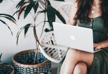 Essential Tools for Email Security in 2025 woman sitting and using MacBook